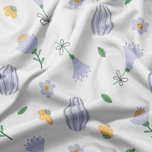 zbliżenie na tkaninę z pastelowymi kwiatkami i subtelną strukturą materiału