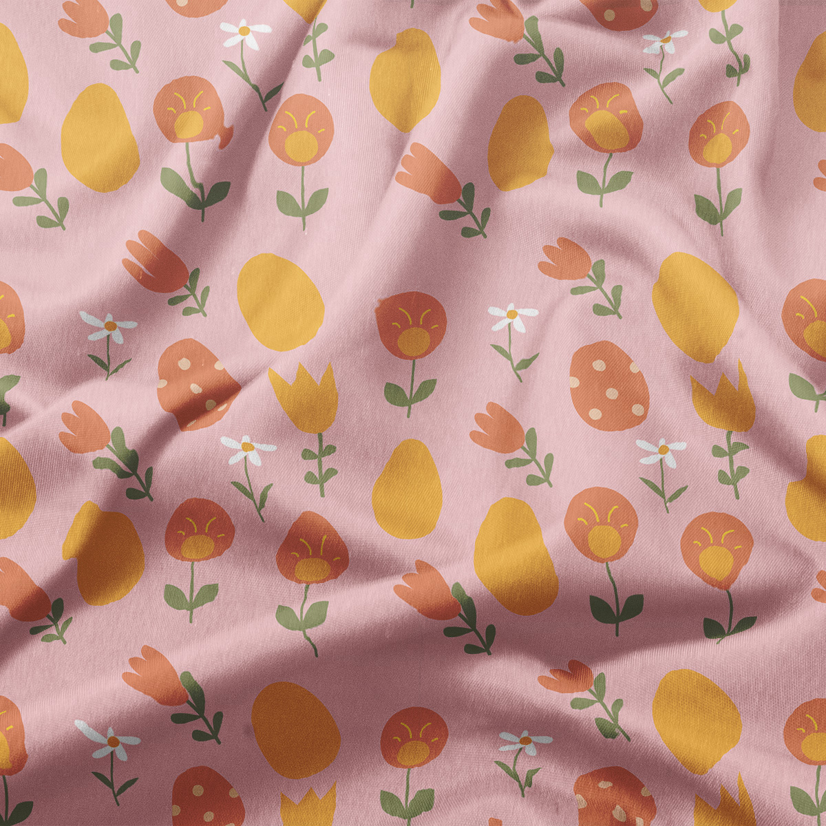 Zbliżenie na fakturę tkaniny i detal wzoru z pisanek, tulipanów i stokrotek