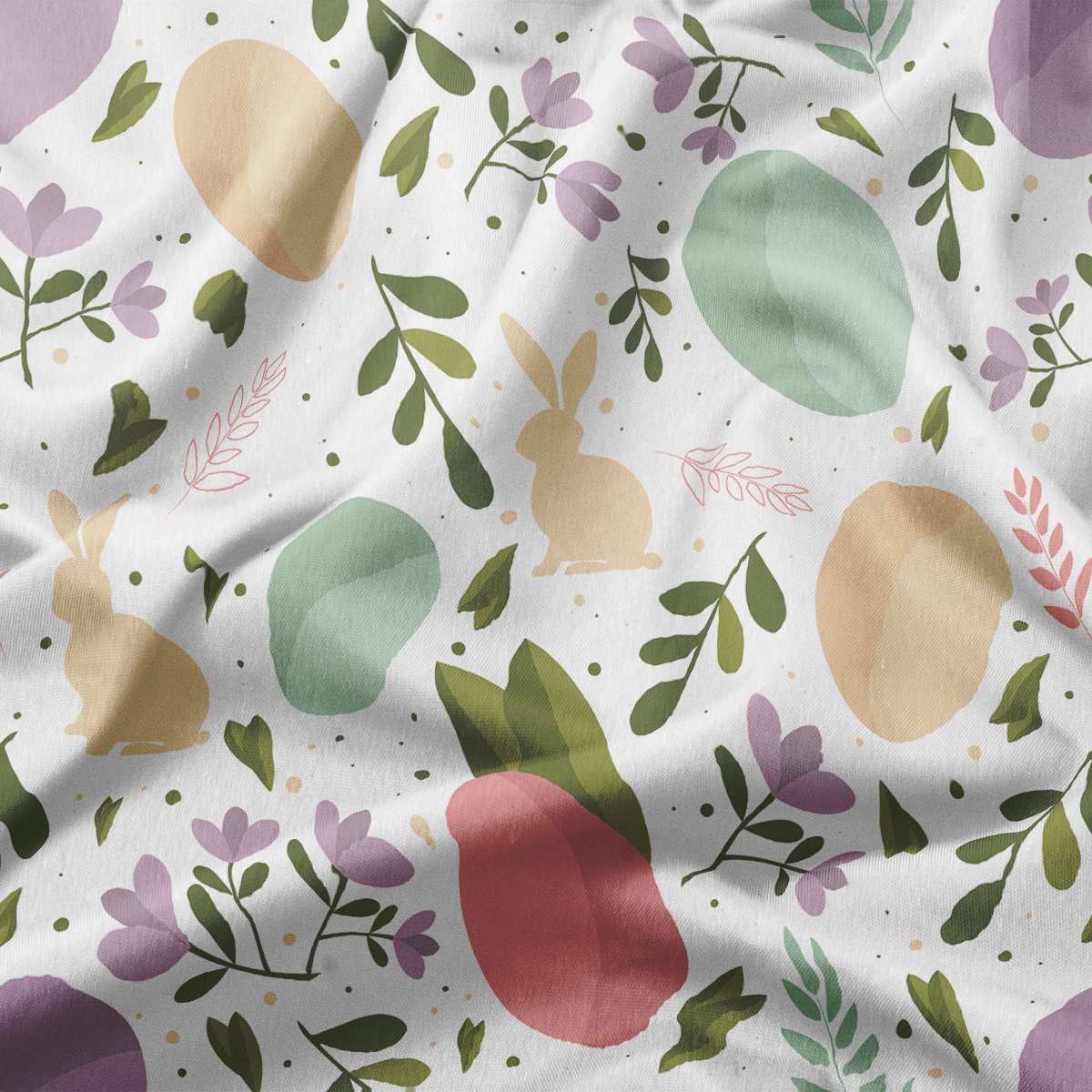 Zbliżenie na fakturę materiału i detale nadruku z jajkami, zajączkami i liśćmi w pastelowych kolorach