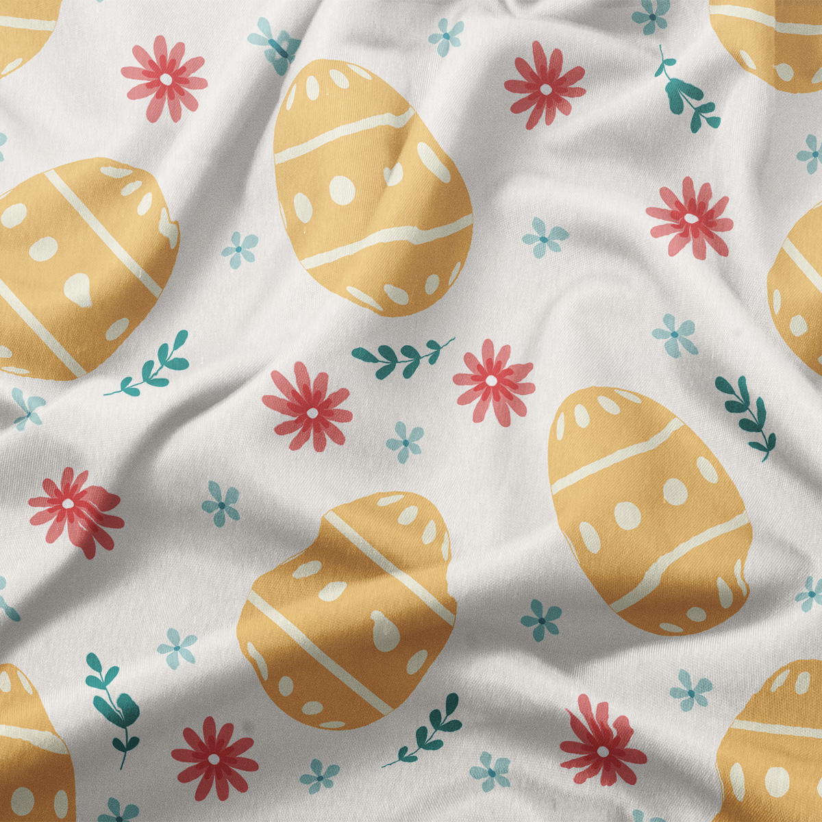 detal tkaniny z nadrukiem pisanek i drobnych kwiatów, zbliżenie pokazujące fakturę materiału