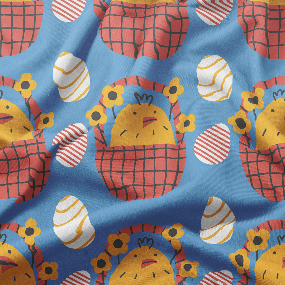 Zbliżenie na detal tkaniny z motywem kurczaczka w koszyku i ozdobnych pisanek