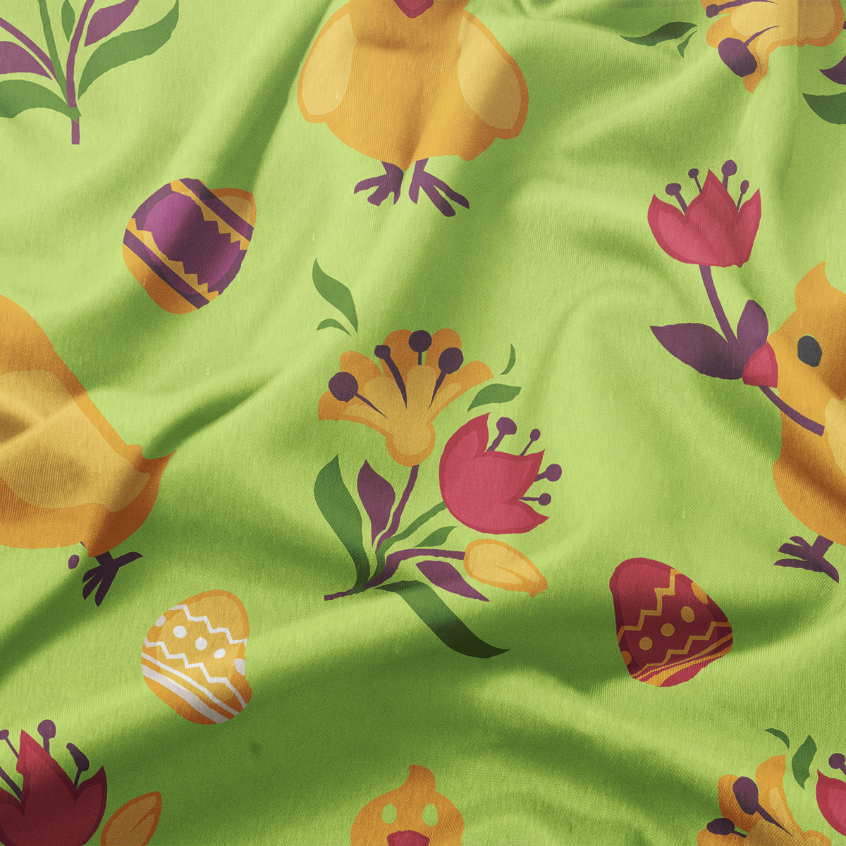 zbliżenie na tkaninę ukazujące rysunkowe kurczaki, wielkanocne pisanki oraz kolorowe kwiaty