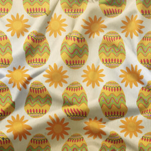 zbliżenie tkaniny pokazujące wzór pisanek i słoneczek oraz fakturę materiału
