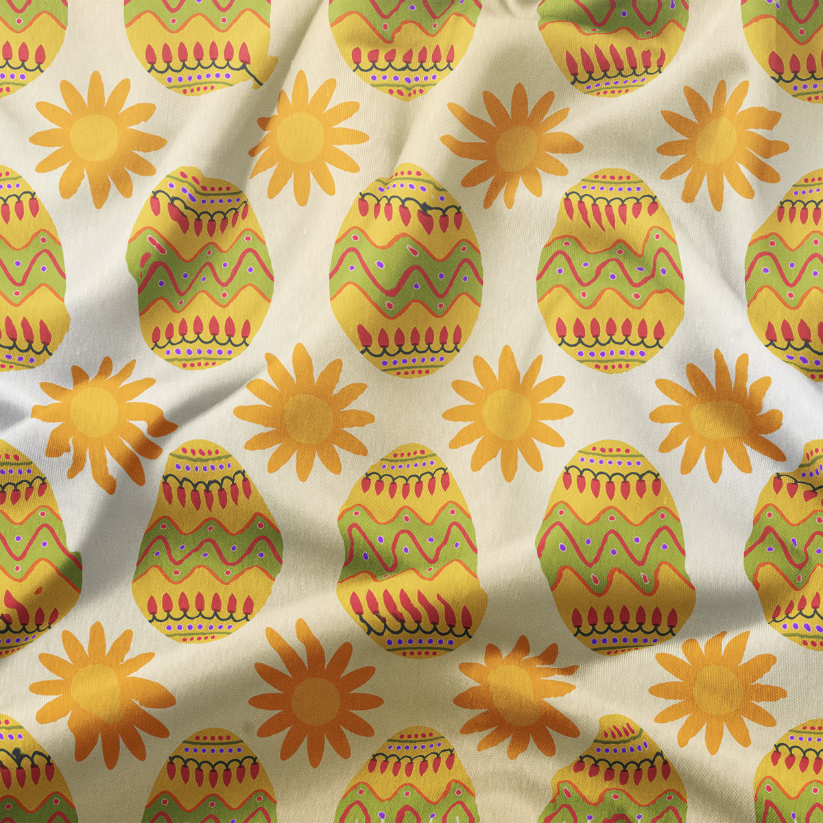 zbliżenie tkaniny pokazujące wzór pisanek i słoneczek oraz fakturę materiału