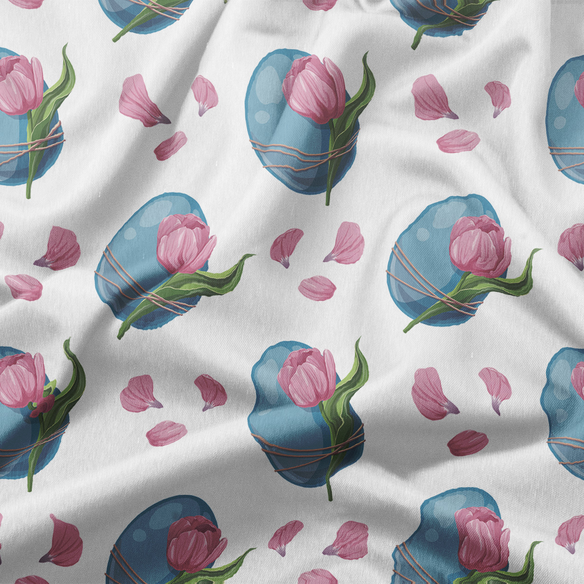 zbliżenie tkaniny pokazujące szczegóły wzoru pisanek, tulipanów i rozsypanych płatków