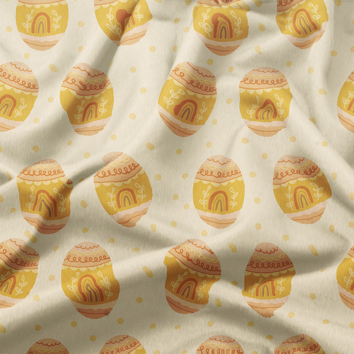 Zbliżenie na wzór i fakturę tkaniny pokazujące żółte pisanki i drobne kropki