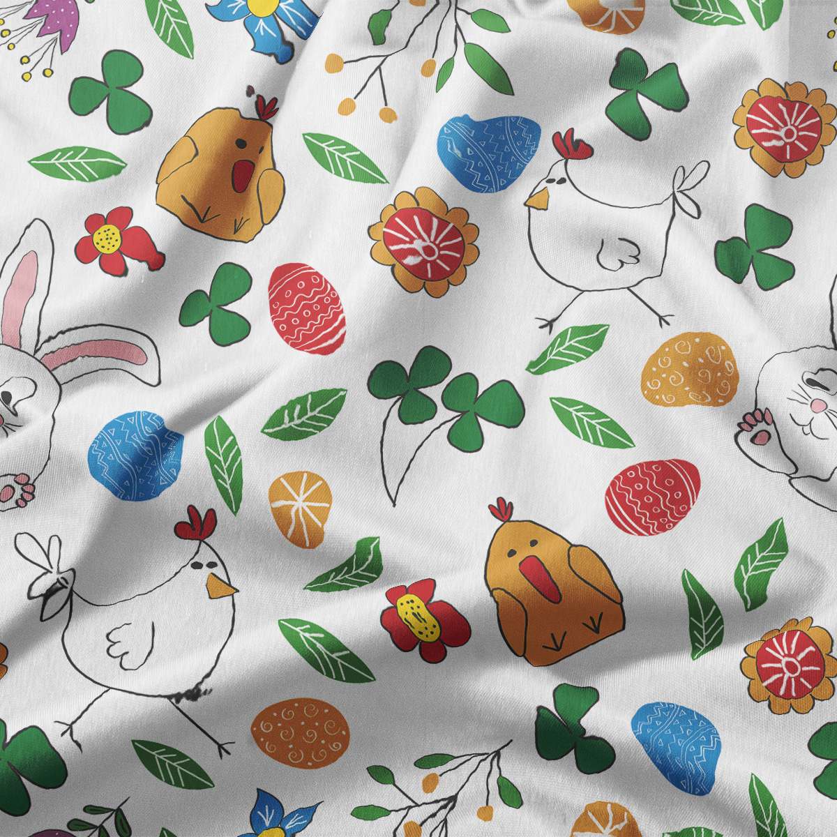 Zbliżenie na wzór obrusy pokazujące kurczaczki, pisanek i zielone listki na jasnym tle