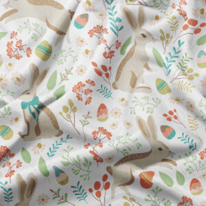 zbliżenie wzoru na materiale pokazujące zajączka, pisanki i drobne kwiaty oraz strukturę tkaniny