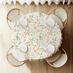 widok z góry na okrągły stół z obrusem, nakryciami i rozmieszczonym wzorem z zajączkami