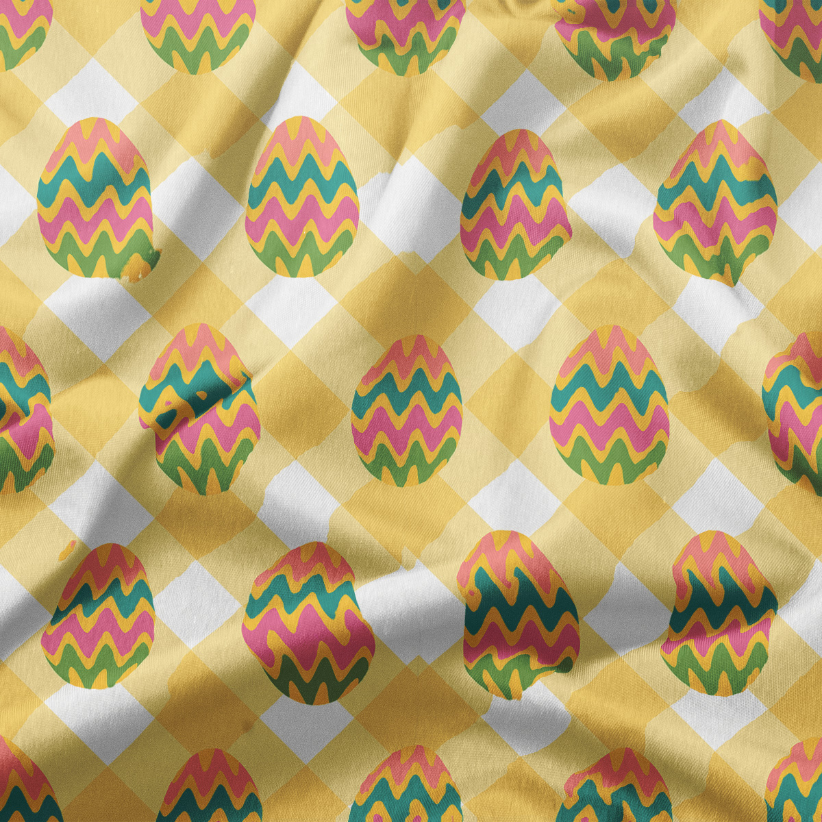 Zbliżenie na wzór obrusu: pisanki z zygzakowymi pasami na żółto-białej kracie i widoczna faktura tkaniny