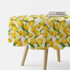 okrągły obrus z żółtymi tulipanami na białym tle na stole widok z boku