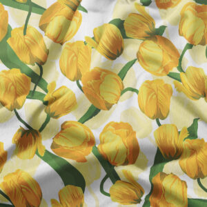 detal tkaniny z motywem żółtych tulipanów i zielonych łodyg zbliżenie