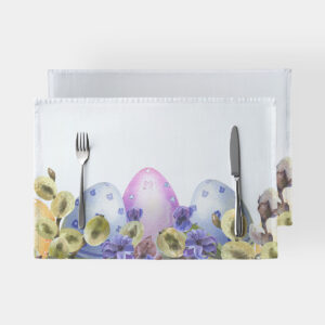 Podkładka z akwarelowymi pisankami i bazami na białym tle, widok z góry