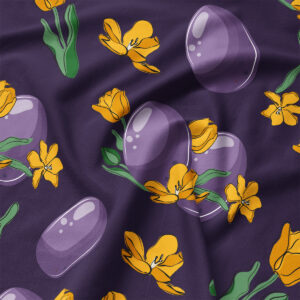 Zbliżenie na tkaninę i szczegóły nadruku fioletowych pisanek oraz żółtych tulipanów