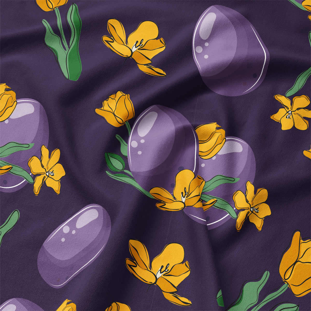 Zbliżenie na tkaninę i szczegóły nadruku fioletowych pisanek oraz żółtych tulipanów