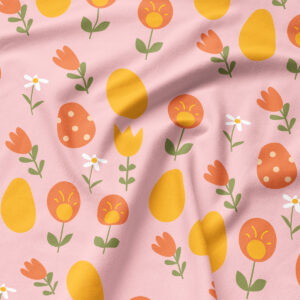 Zbliżenie na wzór i strukturę tkaniny z motywem pisanek i drobnych kwiatów w pastelowych barwach