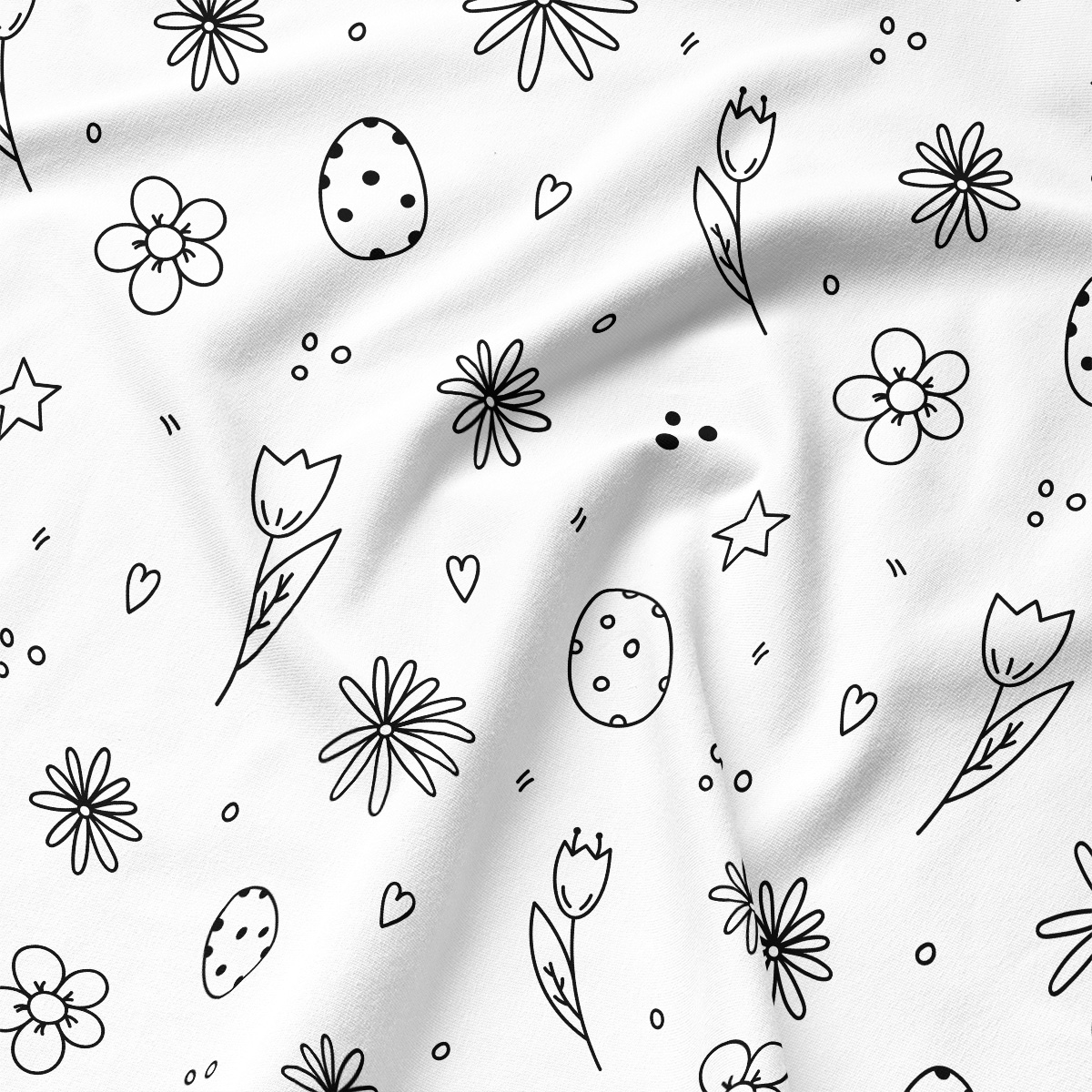 Zbliżenie na tkaninę z delikatnym rysunkiem pisanek, tulipanów i stokrotek w czarnych konturach