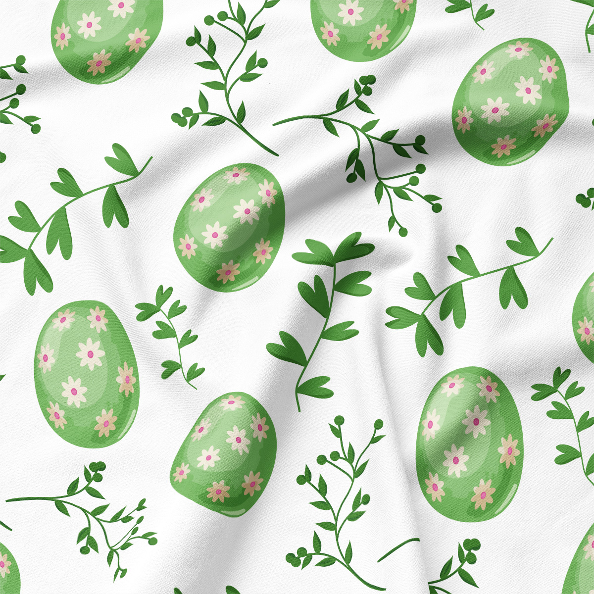 Zbliżenie na tkaninę z wzorem zielonych pisanek i delikatnych gałązek, widoczna struktura materiału