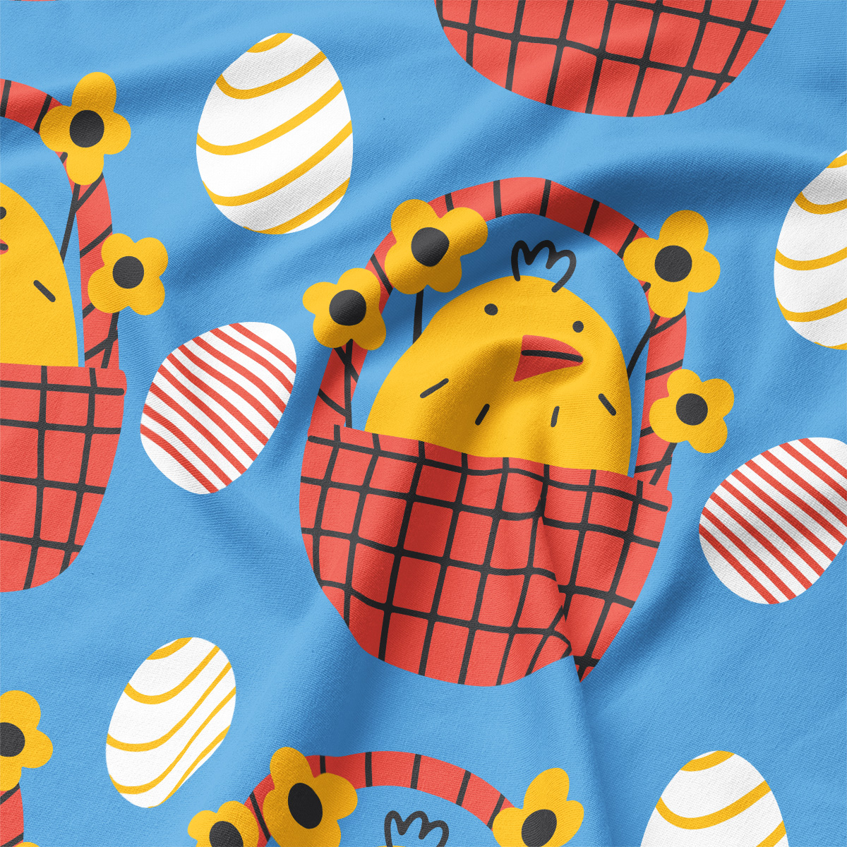 Zbliżenie na detal nadruku z żółtym kurczaczkiem w koszyku i ozdobnymi pisankami