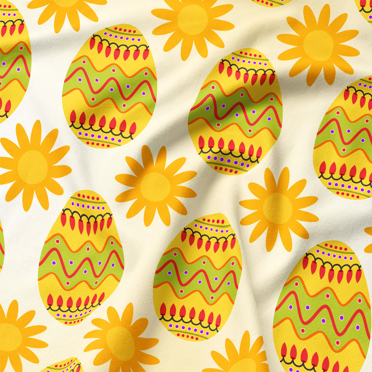Zbliżenie na materiał z dekoracyjnymi pisankami w zielono-czerwone wzory i żółtymi słoneczkami, widoczna faktura tkaniny