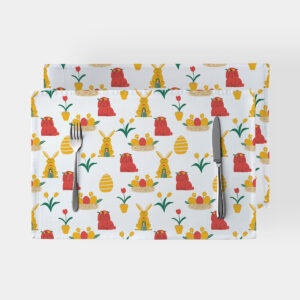 Para podkładek z motywem wielkanocnym z zajączkami i pisankami na białym tle, widok z góry ze sztućcami