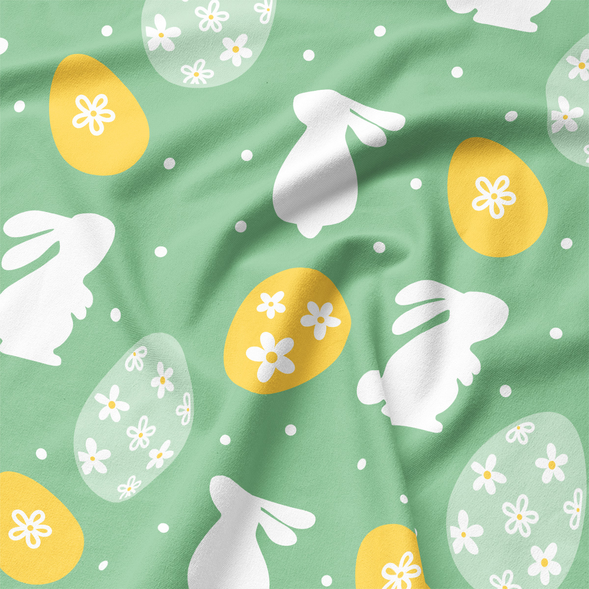 Zbliżenie na fakturę tkaniny i nadruk z białym zającem oraz żółtą pisanką ozdobioną kwiatuszkami