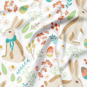 Zbliżenie na wzór podkładki pokazujące zajączka w kokardzie, malowane pisanki i drobne kwiaty w pastelowych barwach