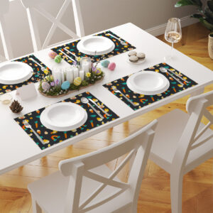 Nakryty stół z kilkoma podkładkami w tej samej wersji wzoru tworzącymi spójną aranżację świąteczną
