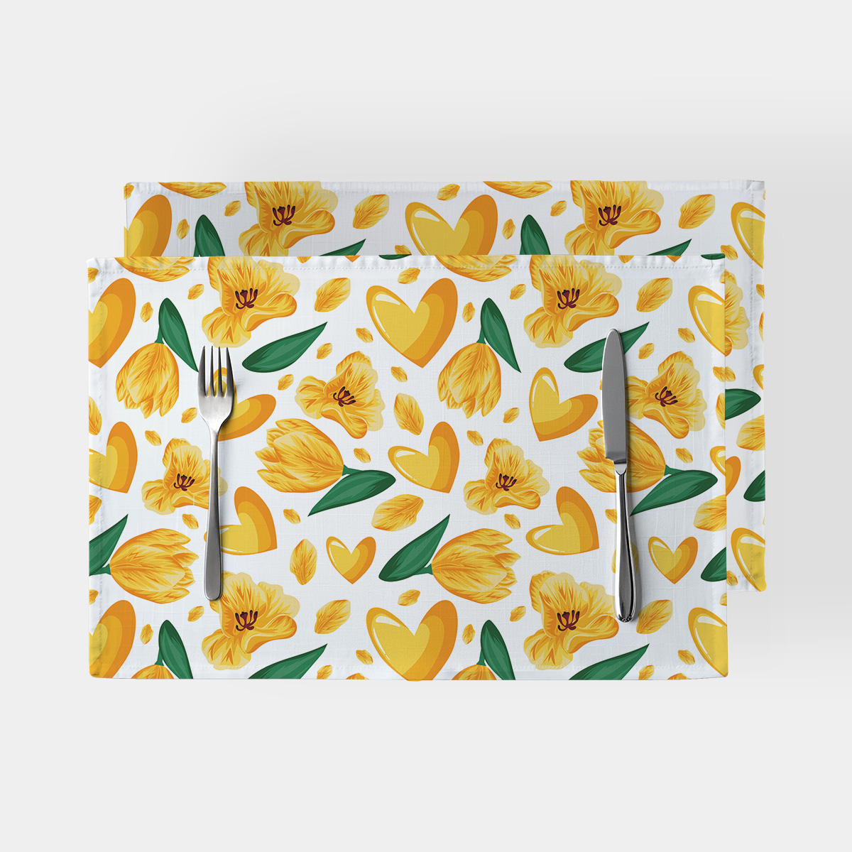 Zestaw dwóch podkładek z wzorem żółtych tulipanów i serduszek na białym tle