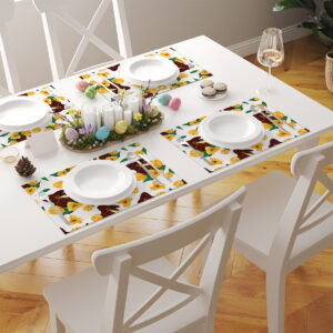 Aranżacja stołu z kilkoma podkładkami w komplecie, talerzami i ozdobami wielkanocnymi