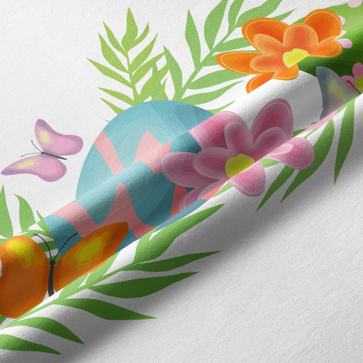 Zbliżenie na detal nadruku: pastelowe pisanki, motylki i zielone liście na tkaninie