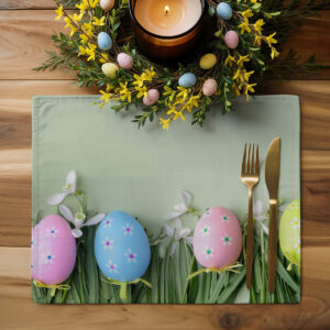 górne ujęcie podkładki z pisanek obok świątecznego wianuszka i świec