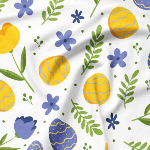 Zbliżenie na materiał pokazujące detale pisanek, tulipanów i zielonych listków