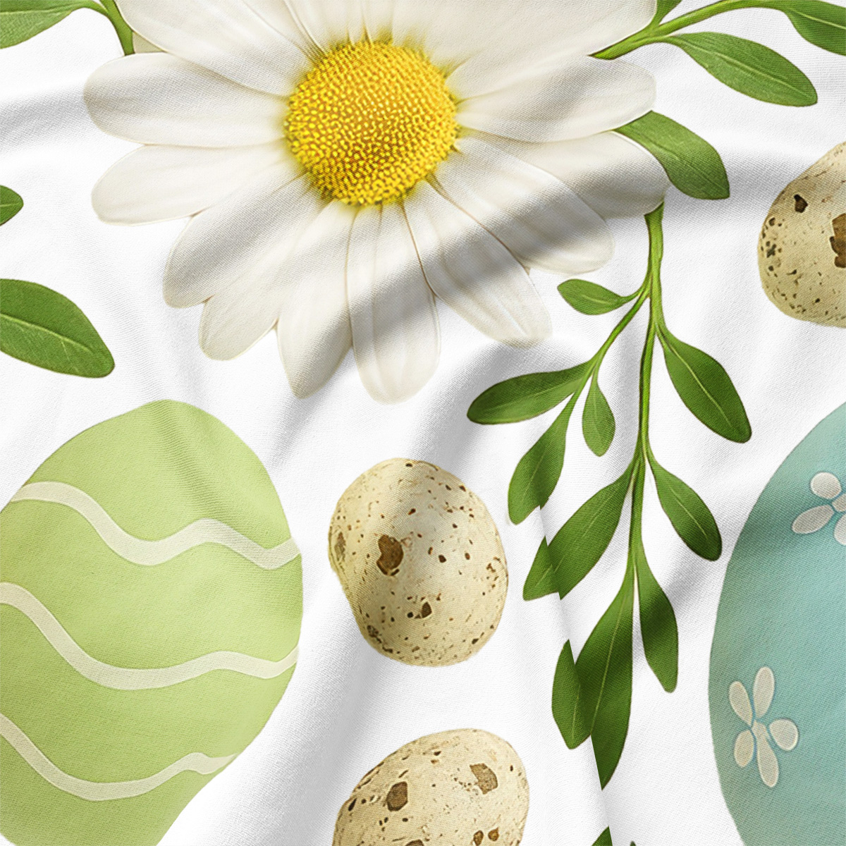 zbliżenie na detal stokrotki, pisanki i zielone liście na materiale