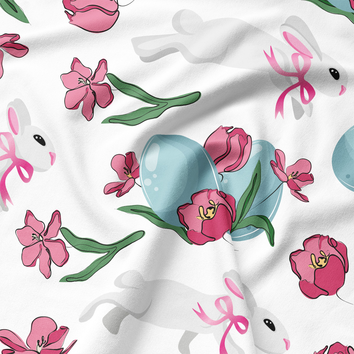 Detal tkaniny z niebieską pisanką, różowym tulipanem i zającem z różową kokardką