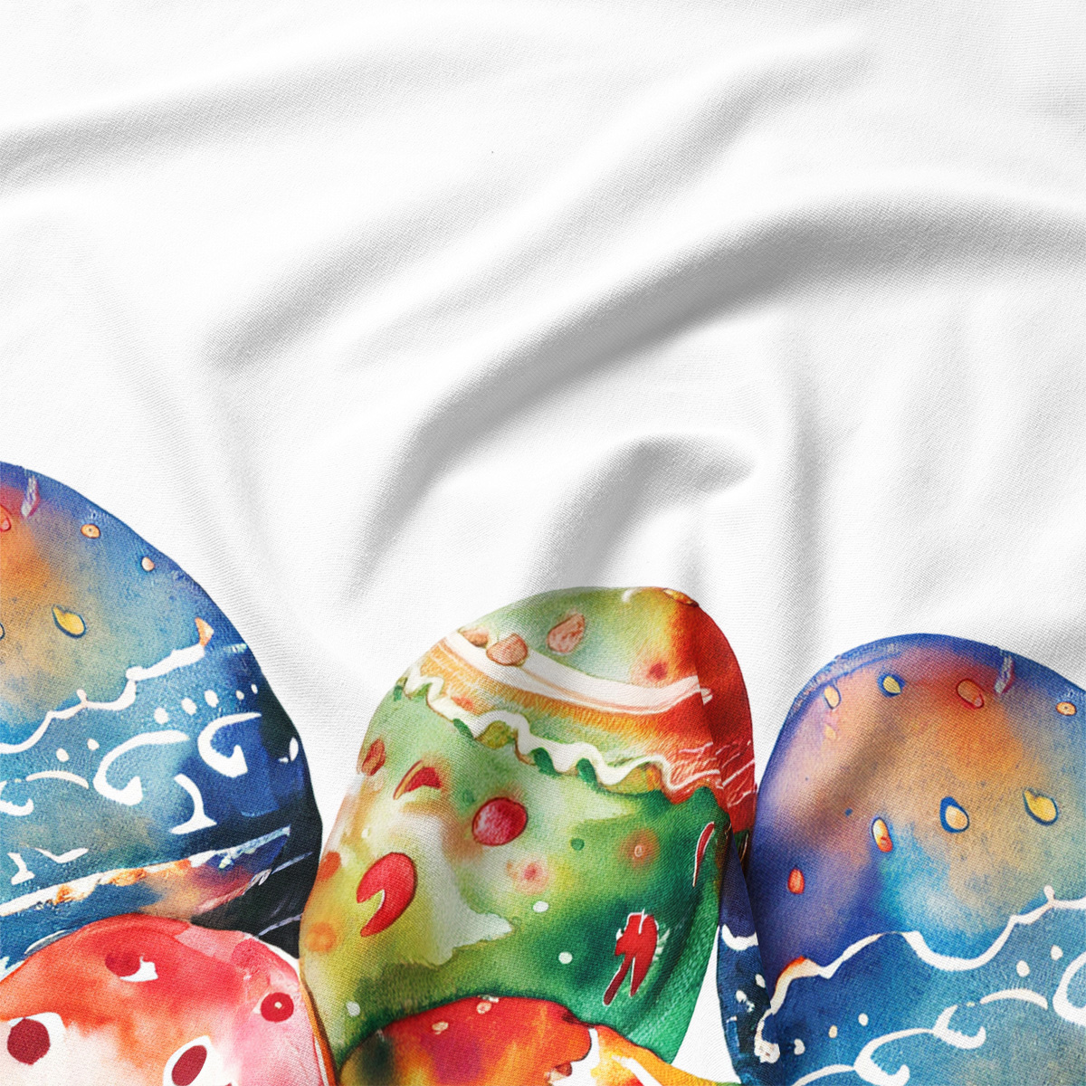 zbliżenie na motyw akwarelowych pisanek i fakturę tkaniny