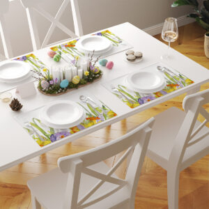 Widok z góry na stół z kilkoma podkładkami w komplecie i pastelowymi pisankami