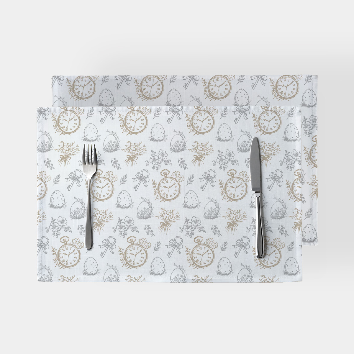 Podkładki stołowe z motywem zegarków, pisanek i bukiecików na jasnym tle, ujęcie z góry