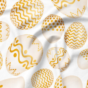 Zbliżenie na tkaninę i drukowane złote pisanki, detal wzoru i faktury materiału