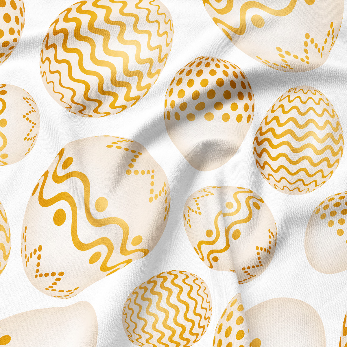 Zbliżenie na tkaninę i drukowane złote pisanki, detal wzoru i faktury materiału