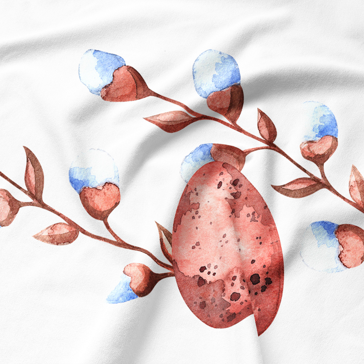 Zbliżenie na akwarelowe jajo i detale brązowych gałązek nadrukowane na tkaninie podkładki