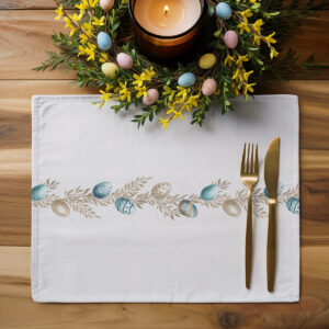 Aranżacja stołu z podkładką, złotymi sztućcami i wiosennym wieńcem dekoracyjnym