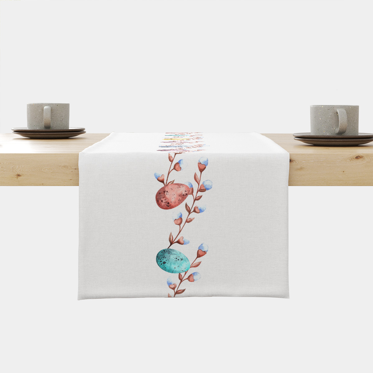 Bieżnik z akwarelowymi pisankami i wiosennymi gałązkami na białym tle