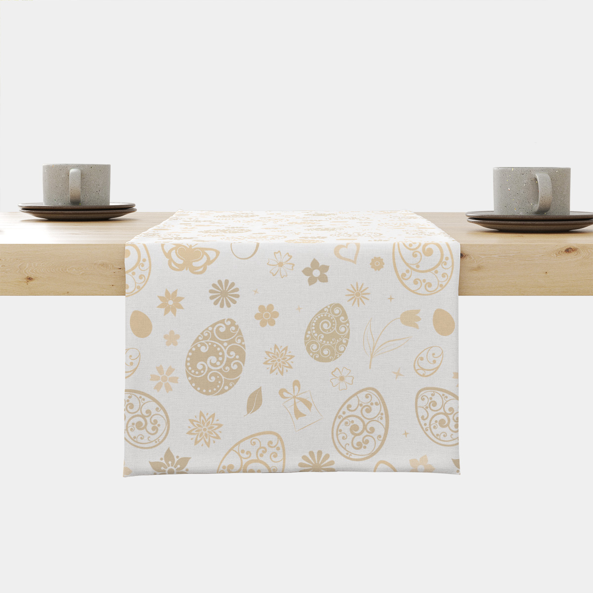 Bieżnik z kremowymi pisankami rozłożony na stole, widok produktu od przodu