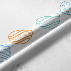 Detale nadruku z kolorowymi pisankami i fakturą tkaniny w zbliżeniu