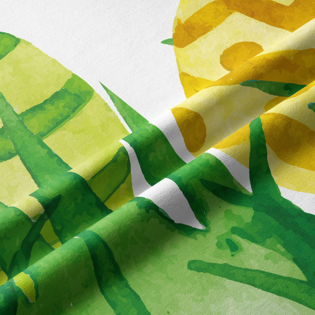 zbliżenie na akwarelowy nadruk zielonych liści i żółtych pisanek na tkaninie