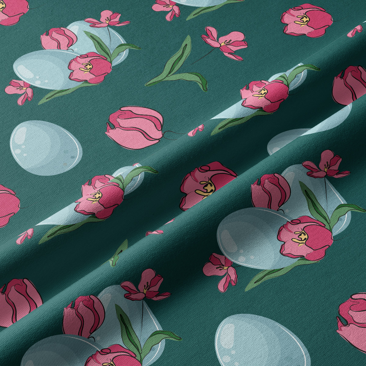 Detal tkaniny z widocznymi różowymi tulipanami, zielonymi liśćmi i jasnymi pisankami