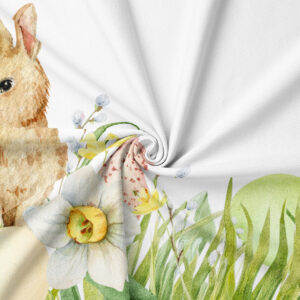 Zbliżenie na akwarelowy nadruk narcyza, jajka i trawy na tkaninie