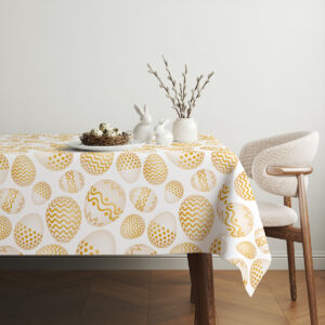 Aranżacja stołu z białymi ozdobami zajączków i gałązkami bazi na obrusem