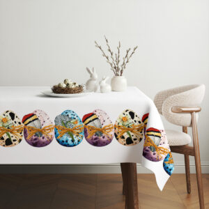 aranżacja stołu z obrusem, talerzem z gniazdem jaj i delikatnymi gałązkami jako minimalistyczna dekoracja